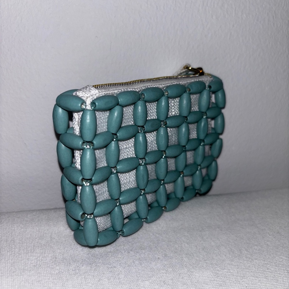 Small Miu Miu beaded zipper pouch. Teal wood beads with canvas lining.
